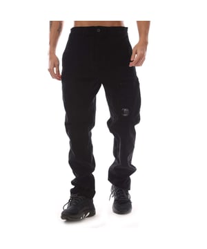 Mens C.P. Company Corduroy Lens Pants in black.- Adjustable drawstring at inner waistband.- Zip fly and button fastening.- Side welt pockets.- Rear patch pocket.- Cargo zip pocket with Lens detail.- Old dyed.- Regular fit.- 97% Cotton  3% Elastane.  Machine washable.- Ref: 17CMPA123A 006410O 999