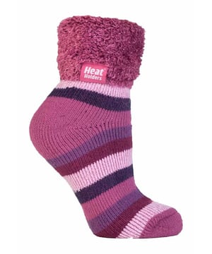 Lounge around the home in these cosy socks. Whether you're looking to stay warm or comfortable indoors, these lounge socks feature a cute and stylish design so you can pair them with any casual outfit! Every Heat Holders® sock, including these lounge socks, are created by UK PATENTED knitting technology. This unique manufacturing process together with Heat Holders® innovative Japanese designed thermal yarn ensures maximum warmth is held close to the skin, keeping your feet warmer for longer. With a strong TOG rating of 2.34, these socks are designed to keep your feet warm as well as retain heat close to the skin. They also prevent your feet from feeling clammy with their soft brushed inner thermal lining. With long pile cushioning, these thermal socks will help keep feet fully comfortable and supported. Heat Holders are made from a specially developed heavy bulk yarn which has extreme thermal-like qualities. These socks would make the perfect gift for any woman who suffers cold feet! Choose from our different colours and styles to suit your woman's fashionable needs! Why not treat yourself to these lovely pair of cosy socks to wear in bed? Featuring a turn over cuff, you can pull up or roll down these socks for a much more comfortable fit! These socks also have a low cut ankle length so you can subtly show off your socks! Stop sliding or slipping on wooden or tiled floors with these non-slip gripped socks. They feature a rubber-like non-slip grip so you can walk around the home comfortably. These socks are available in womens sizes 4-8 UK