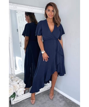 Our Navy Wrap Over Top Frill Hem Midi Dress is the perfect occasion
dress! Featuring a wrap top and skirt with frill edging and sleeves, a
dipped hem and zip up back. Simply pair with heels and a clutch to
complete the outfit!

Model wears: UK 8/ EU 36/ US 4
Model's height: 165cm/ 5'5"
Approx length from centre back to hem: 134cm
Fabric composition: 
Colour: NAVY