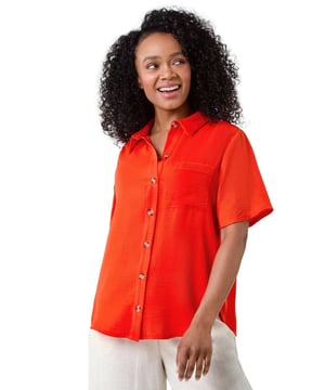 P - Button up Shirt from Roman. Elevate your casual collection with our Petite button-through shirt. Cut from a floaty woven fabric, this lightweight shirt features a classic collar, short sleeve and a playful patch pocket at the bust. It has a full button through front that’s detailed with feminine tortoise shell buttons to fasten. Wear with jeans and a cami for a versatile look or dress it down for holidays with breezy linen trousers and sandals on the beach!