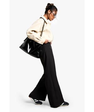 Get your new wide or die pants with the hottest style of the season, the wide leg trouser. Elongate your silhouette with the flattering shape the high waist wide leg trouser has to offer. Team with a tucked in slogan tee and trainers for sports luxe vibes or partner perfectly with a blazer and heels for your next event. It's time to upgrade your day-to-day outfits with a pair of palazzo pants.Style: Wide Leg TrousersDesign: PlainFabric: WovenLength: Stacked