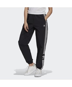 No reason is too small to treat yourself. In fact, you don't even need a reason. And with these adidas track pants in your closet, you can treat yourself any minute of the day. They're all about comfort, which is exactly what you'll feel when you slip them on. This product is made with Primegreen, a series of high-performance recycled materials.  - Regular fit - Drawcord on elastic waist - 100% recycled nylon plain weave - Side zip pockets - Elastic cuffs - Primegreen  Shipped by adidas