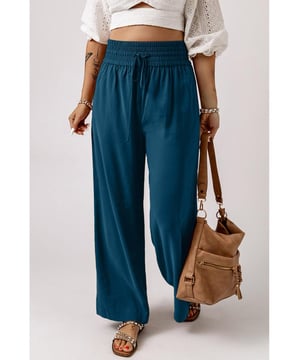Trekkoord met elastische taille voor een veilige en comfortabele pasvorm  
Brede pijpdesign voegt een trendy accent aan je outfit toe  
Geschikt voor zowel casual als chique gelegenheden  
Veelzijdige aanvulling op je garderobe  
Gemaakt voor vrouwen  
Materiaal: 65% viscose 35% polyester