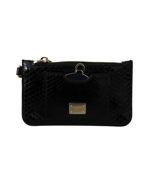 Wunderschones brandneues Dolce & Gabbana Agnese Leder-Portemonnaie mit Python-Muster.
  Hergestellt aus 100% Leder.
  Verfugt uber einen Reissverschluss einen Spiegel und eine Handschlaufe.
  Schlanke schwarze Farbe mit goldenen Metalldetails.
  Metallbesch.