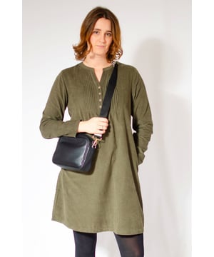 This elegant tunic dress is made in a pure cotton needlecord fabric and features a charming pintuck front with buttons. The high waist and relaxed fit make for a super comfortable and flattering fit.¬† The side pockets make it both stylish and functional. With its notched neck and long sleeves, this dress is perfect for cooler weather and can be effortlessly styled with tights and boots. Look and feel your best in this versatile and timeless piece.