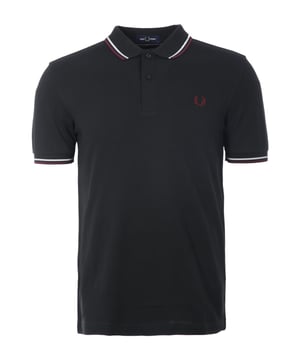 The iconic M3600 Fred Perry Polo Shirt with its legendary twin tipping is a timeless staple  elevated for the modern man. Updated with responsible features and is crafted from BCI cotton pique.This variation of the classic Fred Perry polo shirt from 1952 is cut in a contemporary fit with a slightly slimmer collar and cuff  than the original M12. This timeless polo shirt features a twin-tipped collar and cuffs with a two-button placket and short sleeves.Finished with the signature Fred Perry laurel wreath logo  embroidered on the chest.BCI - By buying BCI cotton products  you're supporting more responsibly grown cotton through the Better Cotton Initiative.-Regular Fit-Pure Cotton Pique-Twin Tipped Detailing-Rib-knit Collar with Two Button Placket-Short Sleeves with Rib-Knit Cuffs-Recycled Tipping &amp; Sewing Threads-Buttons Made from Recycled Materials-Responsibly-Sourced Laurel Wreath Embroidery-Fred Perry Branding