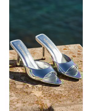 For dinner, drinks and dance floors
Easy slip-on mule style
Outfit-elevating metallic leather
Set on a statement flared heel
Silver goes with everything
Amp up jeans and a nice top or pair with a party dress
