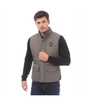 Mens Belstaff Icon Gilet in grey.- Soft corduroy collar.- Centre front snap button fastening and collar.- Two large snap button front pockets.- Belstaff Phoenix patch at chest.- Padded gilet.- Regular fit.- 100% Polyester.- Ref: 105295GMETL