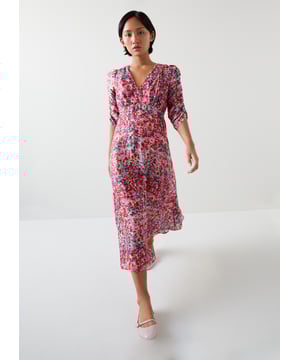 Experience an enchanting garden with the Erin petite watercolour floral jacquard dress. In a delicate pink silk, it features a V neck, full length sleeves, and an exquisite jacquard base with a back zip for a flawless fit. Perfect for evening occasions, it pairs beautifully with subtle gold accessories and elegant heels.