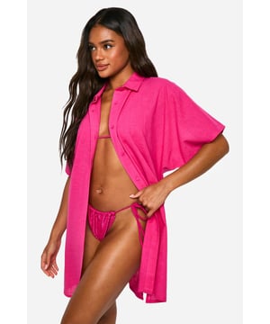 Cover up this summer with this linen-look kaftan shirt. This beachwear shirt features buttons down the front so that it is easy to take off and put on during the day by the beach or pool. The linen look is designed to keep your skin safe and feel lightweight so you can look cute and keep cool.Wear Me With:Pair this lightweight beach kaftan shirt with your favourite sunnies and sandals for a chic vacation look.Style: KaftanNeckline: Collared