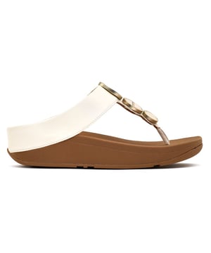 Elevate Your Summer Look With Fitflop's Halo Metallic Sandals. These Natural Flip-flops Boast A Soft Upper With A Decorative Hardware Trim And A Micro-wobbleboard Midsole For Ultimate Fitflop Comfort. The Rubber Outsole Ensures Grip, And Wide Straps Provide A Smooth Fit. A Modest 4cm Heel Adds Height. Perfect For Boardwalk Strolls Or City Walks, Slip Into These Sandals For Style And Comfort.