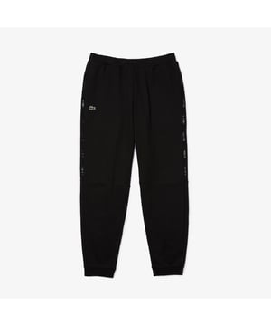 Heren Lacoste Track Pants in zwart.- Elastische tailleband.- Zijzakken.- Geborduurd logo.- Elastische manchetten.- Relaxed fit.- 83% Katoen 17% Polyester.- Ref: XH6849031