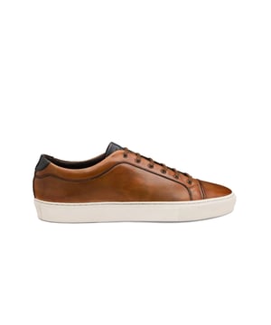 Loake Dash Hand Painted Calf Sneaker Chestnut
The Dash by Loake is a premium Calf Leather sneaker, featuring side-stitch cup rubber soles. Designed by Loake in Kettering and make to an exceptional standard, this is a great way to bring some English style and class to your casual footwear rotation.

100% Leather Upper
Premium leather
Rubber cup sole
Style - DASH