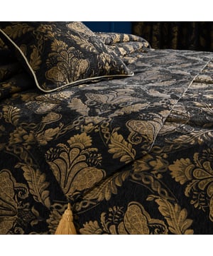 The Shiraz range is the height of opulence. Each piece has an embroidered damask pattern in delicate gold, presented on chenille-style fabric. The Shiraz runner will dress up your dining table, instantly adding elegance to your dining room. With two large golden tassels on each end and a gold reverse, this table runner will elevate any dinner party. Size: 33cm x 230cm