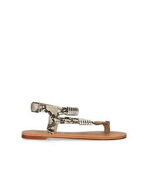 The Klipper sandal features a snake printed upper with silver tone rings across the straps. The ankle is fastened with silver tone buckle.
