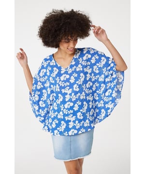 Every warm weather wardrobe needs a versatile floral print like this relaxed fit blouse. It has a V-neck, 1/2 length flared batwing sleeves, a relaxed fit and a hip length hem. Pair with your favourite sandals or flats for a stylish off-duty look.