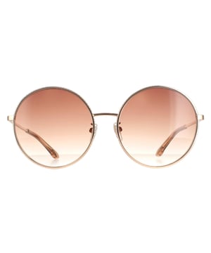 Las gafas de sol redondas Chopard para mujer en color cobre brillante oro marrón degradado schf11v son un elegante estilo redondo fabricado en metal ligero. Las plaquetas nasales de silicona y las puntas de plástico ofrecen comodidad durante todo el día. Las patillas finas llevan el logotipo de Chopard para mayor autenticidad.