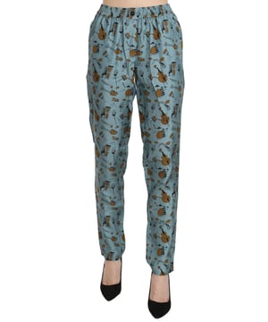 Hermosos pantalones nuevos con etiquetas  
Pantalones de tiro alto y corte tapered  
Estampado de instrumentos musicales en azul  
Detalles de logo  
Hecho en Italia  
Material: 100% Seda