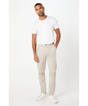 Slim fit design for a modern, tailored silhouette
        Versatile chino style suitable for various occasions
        Clean, minimalist aesthetic with subtle branding
        Front slash pockets and rear welt pockets for practicality
        Belt loops for optional accessorising
    
    Embrace effortless style with these Maine Premium Slim Fit Chino Trousers. Perfect for the fashion-conscious gent, these trousers offer a contemporary slim fit that flatters the silhouette without compromising on comfort. The versatile design makes them ideal for both casual outings and smart-casual events. Style them with a crisp white t-shirt and trainers for a relaxed weekend look, or dress them up with a button-down shirt and loafers for family gatherings or informal work environments. The neutral hue allows for endless styling possibilities, making these chinos a wardrobe staple that will serve you well across seasons. With their timeless appeal and comfortable cotton-rich fabric, these trousers are set to become your go-to choice for everyday sophistication.