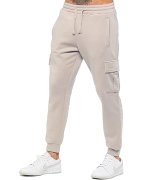 Experience superior comfort and style with Enzo Men's Regular Fit Cargo Joggers! Crafted with a brushed back inner fleece lining, these joggers are designed to keep you cozy all day long. Perfect for casual wear, they feature convenient 2 side slash pockets and 2 cargo pockets, providing ample storage space for your essentials. Stay on-trend with the cuffed leg design, offering a modern silhouette and added comfort.