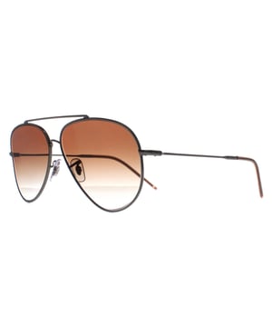 Ray-Ban Aviator Unisex Gunmetal Brown Gradient RB0101S Aviator Reverse  Sunglasses are a captivating reimagination of the classic aviator design. Crafted with meticulous attention to detail, these sunglasses feature a striking reverse color scheme, accentuating the iconic teardrop-shaped lenses and sleek metal frame. The bold contrast of colors adds a contemporary edge while maintaining the timeless appeal of the Aviator style. Engineered for both style and durability, these sunglasses offer superior UV protection and comfort, making them an essential accessory for those who appreciate fashion-forward design and unparalleled quality.