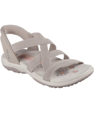 Geniet van zonnige dagen in luchtig comfort met Skechers Hands Free Slip-ins: Reggae Slim - Stretch Flex. Deze sandaal met bandjes is ontworpen met ons hielkussen en heeft een bovenwerk van stretchstof met een hielstuk achter en een voetbed met kussentjes.