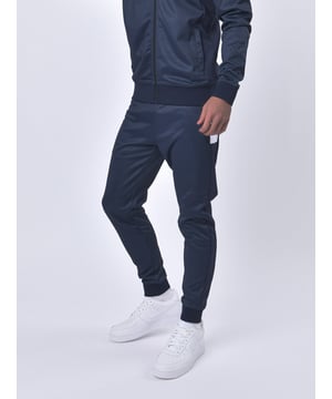 LUKE is your go-to brand for terrace-ready styles - and these joggers offer just that. They are crafted from a classic check printed tricot, detailed with contrast cut and sew side panels and has a comfy draw cord waist and essential side zip pockets. They are then complete with the brand's iconic lion head rivet on the lef