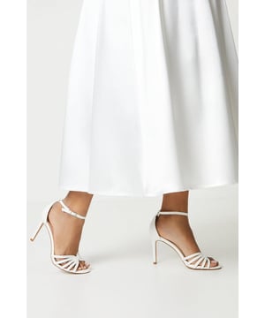 Whether attending a wedding or a dinner on vacation, these stunning heeled sandals are a versatile option for those looking for something sumptuous, yet, subtle. Their classic construction features a feminine peep toe, dainty ankle strap and gorgeous strappy front part. This timeless shoe will serve your wardrobe for years to come.