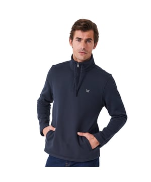 A brand-new take on a half zip sweatshirt in taupe. Everything we do is designed with the British coast in mind – and it rings especially true with this style. With a funnel collar to warm you from the sea breeze and pockets for stashing essentials, it’s just what you need for long brisk walk.