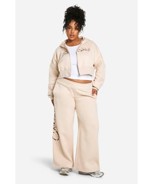 Striking leopard print design for a bold statement
        Wide-leg trousers for ultimate comfort and style
        Zip-up hoodie with cropped length for a trendy silhouette
        Coordinated set perfect for effortless dressing
        Soft cotton blend fabric for all-day comfort
    
    Make a fierce impression with this eye-catching leopard print tracksuit from Boohoo. The wide-leg trousers offer a relaxed fit that's perfect for lounging or running errands, while the cropped zip-up hoodie adds a contemporary twist to the classic tracksuit silhouette. Ideal for casual outings, this coordinated set allows for easy mixing and matching. Style it with chunky trainers and a crossbody bag for a laid-back weekend look, or dress it up with heeled boots and statement jewellery for a night out with friends. The versatile design makes it suitable for various casual occasions, from coffee dates to family gatherings. Embrace your wild side and stand out from the crowd in this bold and comfortable tracksuit that combines fashion-forward design with everyday wearability.
