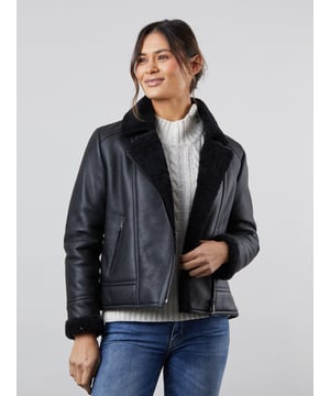 Our new-in flattering Lindeth aviator jacket is crafted in rich sheepskin with a smooth external nappalan finish. The black colourway is elegant and timeless and you can pair this jacket easily with your favourite knits to stay cosy all winter long.Featuring an asymmetric zip front inspired by biker jackets, the snuggly lapel collar and cuffs will keep you warm and cosy when the chilly weather comes around. Plus you can keep your hands extra warm with two handy front zip pockets.Sheepskin is nature's finest insulator and temperature regulator, meaning you will stay unbelievably warm and comfortable without overheating. The Lindeth jacket truly is the perfect investment for years to come.Sizing InformationThese measurements are based on a size 12 and will vary slightly between sizes.Approximate centre back length: 61cmApproximate sleeve length from shoulder to cuff: 62cm Approximate sleeve length from underarm to cuff: 45cmThe DetailsStyle Name: Lindeth Sheepskin Aviator JacketColour: BlackMaterial: 100% sheepskin with a nappalan finishFit: True fitAsymmetric front zip fasteningSheepskin lapel collarTwo front zip pocketsSheepskin cuffsAnd on the inside100% sheepskin