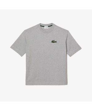 Finest materials. Brand’s singular expertise. The perfect expression of Lacoste’s timeless wardrobe -Loose fit is loose ease on body and sleeves  lower shoulders and armholes -Unisexe T-shirt in organic heavy jersey with big croc 80' on chest -7cm iconic original badge crocodile at chest -3cm green crocodile at under middle back collar