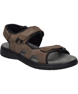 Der Marlon 06 von JOSEF SEIBEL, in der Farbe brasil-kombi, ist eine Sandale, die speziell für Herren designt wurde und sich perfekt für die warmen Tage des Sommers eignet. Gefertigt aus einer Kombination von Nubuk-Kalbsleder und Textil, bietet dieser Schuh nicht nur eine ansprechende Optik, sondern auch hervorragende Bequemlichkeit. Dank der herausnehmbaren Rindsvelour-Innensohle ist er auch für Träger mit individuellen orthopädischen Bedürfnissen geeignet. Die Direktbesohlung, bei der die PU-Sohle direkt in die Sohlenform eingespritzt wird, macht den Schuh besonders weich, flexibel und leicht, ideal für lange Tage im Freien. Der Klettverschluss garantiert eine individuelle Passform und erleichtert das An- und Ausziehen. Dieses Modell ist ein Paradebeispiel für modernen Komfort und Funktionalität, kombiniert mit hochwertigen Materialien und einer Fertigung, die bewusst auf Nachhaltigkeit und Langlebigkeit setzt, fernab von Fast Fashion. Ob in der Freizeit oder als Teil der Casualmode, der Marlon 06 ist ein vielseitiger Begleiter, der Komfort und modische Akzente geschickt vereint.