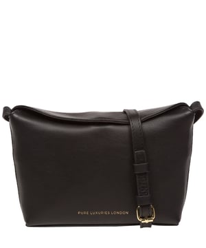 The 'Lolo' cross body bag from the Pure Luxuries Marylebone collection is handcrafted from high-quality, genuine Nappa leather with a natural super-soft touch. The bag is secured by a magnetic closure which opens to reveal a 100% cotton-lined interior and includes two slip pockets. Features gold-coloured metal fittings alongside the adjustable slim leather strap, with a maximum drop length of 65cm. The Pure Luxuries logo is embossed in gold foil for a beautifully simple finishing touch.