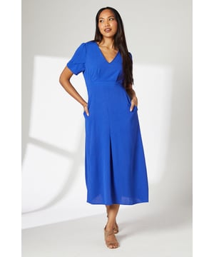 Elegant V-neckline for a flattering silhouette
        Unique sleeve detail with layered fabric for added interest
        Midi length perfect for versatile styling
        Fitted waist to accentuate your figure
        Side pockets for practicality and comfort
    
    This woven midi dress from Principles is a versatile addition to your wardrobe, suitable for various daytime occasions. The eye-catching sleeve detail adds a touch of sophistication to the simple silhouette, making it stand out from your average midi dress. Style it with strappy sandals and a woven tote for a relaxed weekend brunch, or pair it with ballet flats and a denim jacket for a casual day out shopping. The V-neckline and fitted waist work together to create a flattering shape, while the midi length offers coverage and elegance. For family gatherings or casual meetups with friends, accessorise with delicate jewellery and a crossbody bag to complete your look. The side pockets add a practical element, perfect for keeping your essentials close at hand during your daytime adventures.