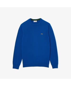 The essential sweaters of Lacoste wardrobe. Essential sweater in organic cotton. Easy to wear over our iconic polo (or shirt) for working time  and over our tee-shirt for week-end as well. Essentials Regular fit: Natural ease on body and sleeves Crew neck in jersey Cotton is a natural fiber  it makes soft and comfortable clothes. Organic cotton is farmed with limited use of pesticides. Contrasted herringbone detail inner neckline Contrasted line at right bottom sleeve 3cm green crocodile at chest