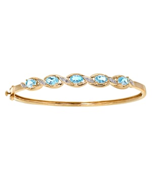 9K (375) geel goud: 7,3 gram; # Diamant: 0,05 ct; # Blauwe Topaas: 2,79 ct