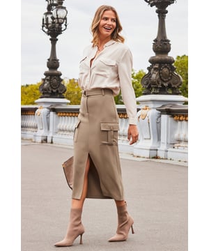 This season's hottest skirt
Trending cargo pockets
Waist-defining D-ring belt
Front split for a sexy silhouette
Do smart-casual with a vest top and Birkenstocks
Going out? Add a slinky cami and heels
