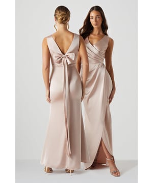 Refined and classically elegant, this maxi dress was made to flatter and enhance every woman's figure. Featuring a dramatic bow at the back to tie the design and give it a fresh note of playfulness. Made from Olivia satin: exuding a lustrous sheen, this satin fabric balances structure and fluidity with masterful perfection, achieving a curated silhouette whatever the style. Level of stretch: little. This dress fastens with a rear concealed zip. Perfect for a town hall wedding. ?