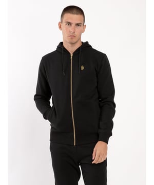 Comfortable, cool and classic, this hoodie from LUKE is cut from a cotton fleece back fabrication which ensures warmth and comfort in the colder months. It is detailed with a centre gold zip fastening running from hem to hood. The classics are considered and has soft rib cuffs and hem and is complete with the brands iconic lion head embroidery on the left chest. Iconic LUKE BLACK, GOLD, RED lion head embroidery. Iconic LUKE tri-colour trim tape. Matte black eyelets and cord ends. Centre front gold nylon zip. Side entry pockets. Ribbed cuff and hem.