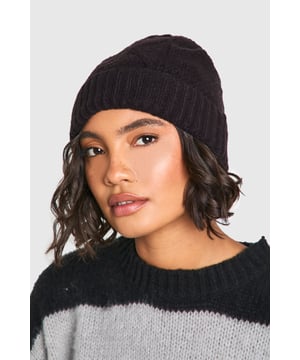 Classic cable knit pattern for timeless appeal
        Soft, stretchy fabric for a comfortable fit
        Ribbed cuff for a secure and snug wear
        Versatile design suitable for various casual outfits
        One-size-fits-most for convenience
    
    Embrace the chilly weather with our stylish Zopfmuster-Beanie, a must-have accessory for your winter wardrobe. This cosy hat features a classic cable knit pattern that adds texture and visual interest to any ensemble. Perfect for casual outings, family gatherings, or simply running errands, this beanie effortlessly combines warmth and fashion. Style it with a chunky knit jumper and your favourite jeans for a laid-back look, or pair it with a sleek puffer jacket for a more polished appearance. The versatile design makes it an ideal companion for various casual occasions, ensuring you stay warm and trendy throughout the colder months. Whether you're heading to a coffee shop or enjoying a brisk walk in the park, this Zopfmuster-Beanie is the perfect finishing touch to your outfit.