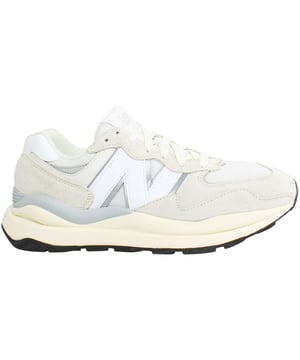 The New Balance 5740SLA Women's Beige Trainers are a stylish and versatile choice for everyday wear. Here are the key features of these fashionable trainers:

 Classic 574 Silhouette:  The 5740SLA trainers feature the iconic silhouette of the New Balance 574, known for its timeless design and retro flair.

 Comfortable Cushioning:  Equipped with cushioned midsoles, these trainers provide excellent comfort and support for all-day wear.

 Durable Outsole:  The durable rubber outsole offers reliable traction and grip on various surfaces, ensuring stability and confidence with every step.

 Versatile Style:  Whether you're running errands, meeting friends, or going for a casual stroll, these trainers offer versatile style that effortlessly complements your everyday look.

 Enhanced Breathability:  The mesh panels incorporated into the design enhance breathability, keeping your feet cool and comfortable throughout the day.