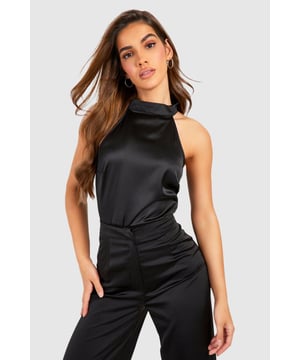 Covering up has never looked so good thanks to our fire high neck bodysuit range. Featuring a high neckline that's perfect for colder months, a long sleeve turtleneck bodysuit is a must have in every wardrobe. Comfortable, versatile, and a perfect base layer for any outfit, pair yours with some high waisted split-hem jeans and barely there heels to be style inspo. Give luxe vibes in a frill sleeve high neck body or make a statement in an animal print mesh number. Style: BodysuitDesign: PlainFabric: WovenLength: RegularNeckline: High NeckSleeve Length: Sleeveless