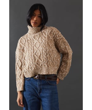 Intricate cable knit pattern for a textured look
        Cosy roll neck design for extra warmth
        Relaxed, oversized fit for comfort and style
        Dropped shoulders for a contemporary silhouette
        Ribbed cuffs and hem for a snug finish
    
    This Cable Knit Roll Neck Jumper from Warehouse is the epitome of casual chic. The intricate cable knit pattern adds depth and interest to your outfit, while the oversized fit creates a relaxed, effortless vibe. Perfect for those chilly autumn days or cosy winter evenings, this jumper is versatile enough to dress up or down. For a laid-back look, pair it with wide-leg jeans and trainers, as shown in the image. To dress it up a bit, try tucking the front into a leather midi skirt and adding ankle boots. The neutral tone makes it easy to style with various colours and textures in your wardrobe. Whether you're heading to a casual family gathering or meeting friends for a coffee, this jumper will keep you warm and stylish. Its timeless design ensures it will remain a staple in your wardrobe for seasons to come.