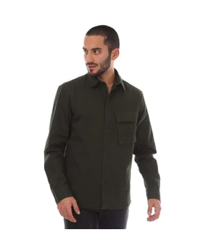 Mens Belstaff Garment Dye Cotton Scale Shirt in green.- Point collar.- Centre front button fastening.- Signature tilted flap pocket.- Adjustable buttoned cuff.- Belstaff Phoenix patch on sleeve.- Garment-dyed cotton twill.- 100% Cotton.- Ref: 104537TLGRN