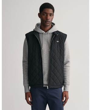 Crafted in a diamond quilting structure, this Quilted Windcheater Vest features recycled polyester padding and is treated with a water-repellent finish. Design details include a one-way zipper at the front, snap buttons at the collar, slanted welt side pockets and an elasticated hem and cuff with a press button adjuster.
Regular fit  Above hip length  Diamond quilting  Water-repellent 
&nbsp;
Shell - Polyester 100%Lining - Polyester 100%Padding - Recycled Polyester 100%
&nbsp;
7006341
&nbsp;
&nbsp;