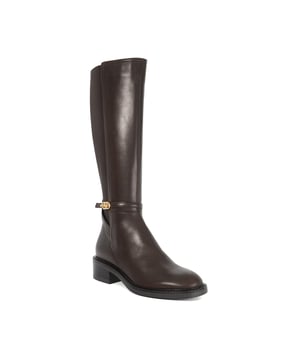 Step into the new season with our classic style: Tias. Knee-high boots featuring our branded DD buckle detail, made from premium leather, these statement boots boast a round toe with a block heel and a convenient side zip fastening. Partner with everything from skinny jeans to midi dresses, depending on your plans.