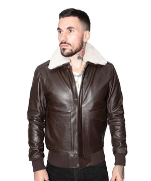We’ve put a twist on the timeless bomber, adding a classic shirt style sheepskin collar, which is detachable to fit for use in warmer weather. This style is kept straightforward with the only addition to the jacket front being two deep pockets, which provide easily accessible storage, whilst keeping to the minimalist style of this jacket. This jacket comes in a slim fit which is aided by a rib knit hem and cuffing to provide a tapered fit which is form fitting. Made of our cow hide leather this jacket has both a premium feel to it and make for a durable piece which is sure to last as time goes by. • High quality real cow hide • Rib knit hem and cuffs for tapered fit • Concealed YKK zip on jacket front • Classic shirt style collar • Pockets integrated into the jacket liningWe’ve put a twist on the timeless bomber, adding a classic shirt style sheepskin collar, which is detachable to fit for use in warmer weather. This style is kept straightforward with the only addition to the jacket front being two deep pockets, which provide easily accessible storage, whilst keeping to the minimalist appeal of this jacket. This jacket features tapering at the waist and cuffs by the introduction of rib knit material, which makes for a more aesthetic fit. Made of our cow hide leather this jacket has both a premium feel to it and make for a durable piece which is sure to last as time goes by. • High quality real cow hide • Rib knit hem and cuffs for tapered fit • Concealed YKK zip on jacket front • Classic shirt style collar • Pockets integrated into the jacket lining