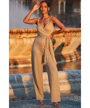Cue all eyes on youCrafted from shimmering metallic plisse fabricWrap front, belted waist - it's made to flatterElongating wide-leg styleStatement knot shoulder detailGo all out with gold accessoriesInside leg to fit: Short 29" | Regular 31" | Long 33"