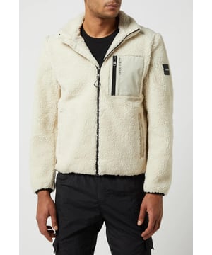 Calvin Klein Men's Sweat Zip Through Jacket.
Teddy Fur.
Straight Model.
Stand-up Collar with Logo Stripes.
Zipper Fastening. 
Chest Pocket with Zipper. 
Side Pockets with Press Stud.  
Contrast Inserts.
